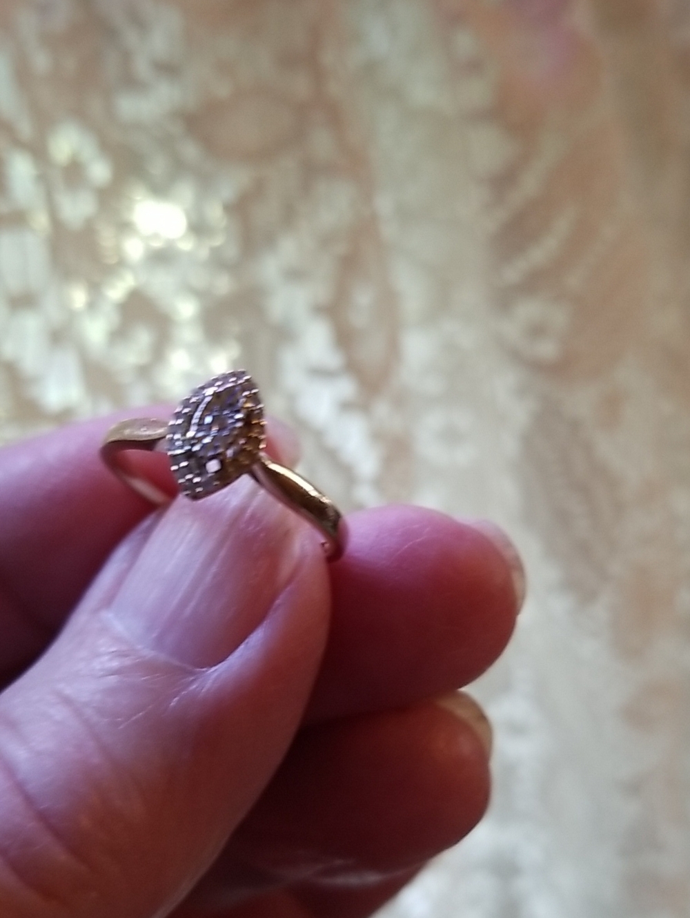 10K gold ring with small center diamond